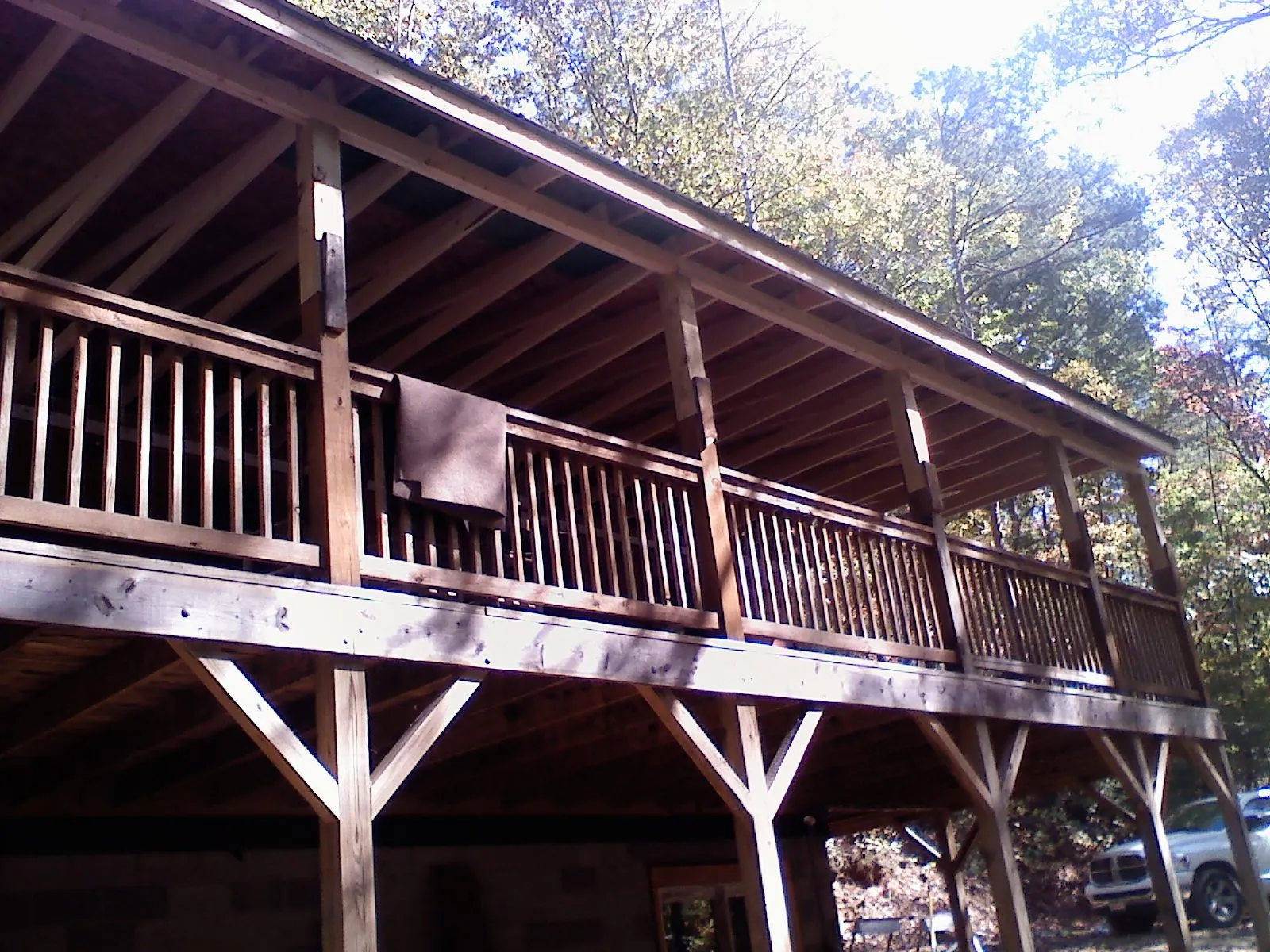 Timber framing under a new elevated porch and deck — Roof Leak Repair in North Fork by Roofing Brothers